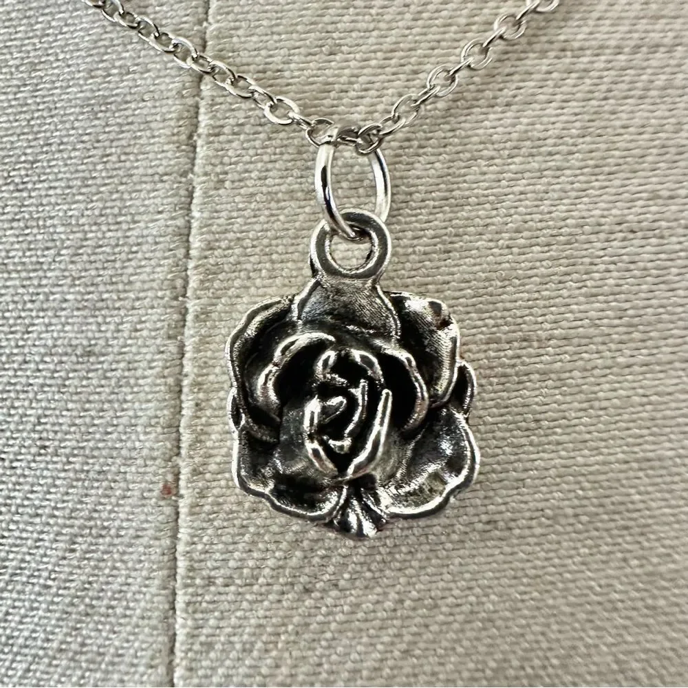 Silver tone rose pendant necklace